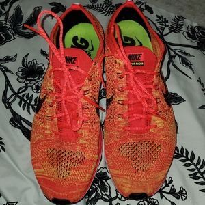 Men's size 10.5 Nike Flyknit racers. Orange and yellow. Excellent condition.